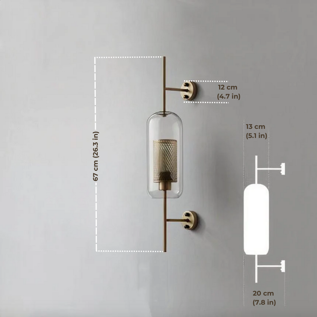 Alegria gold glass wall sconce flanking a bathroom mirror, casting warm light