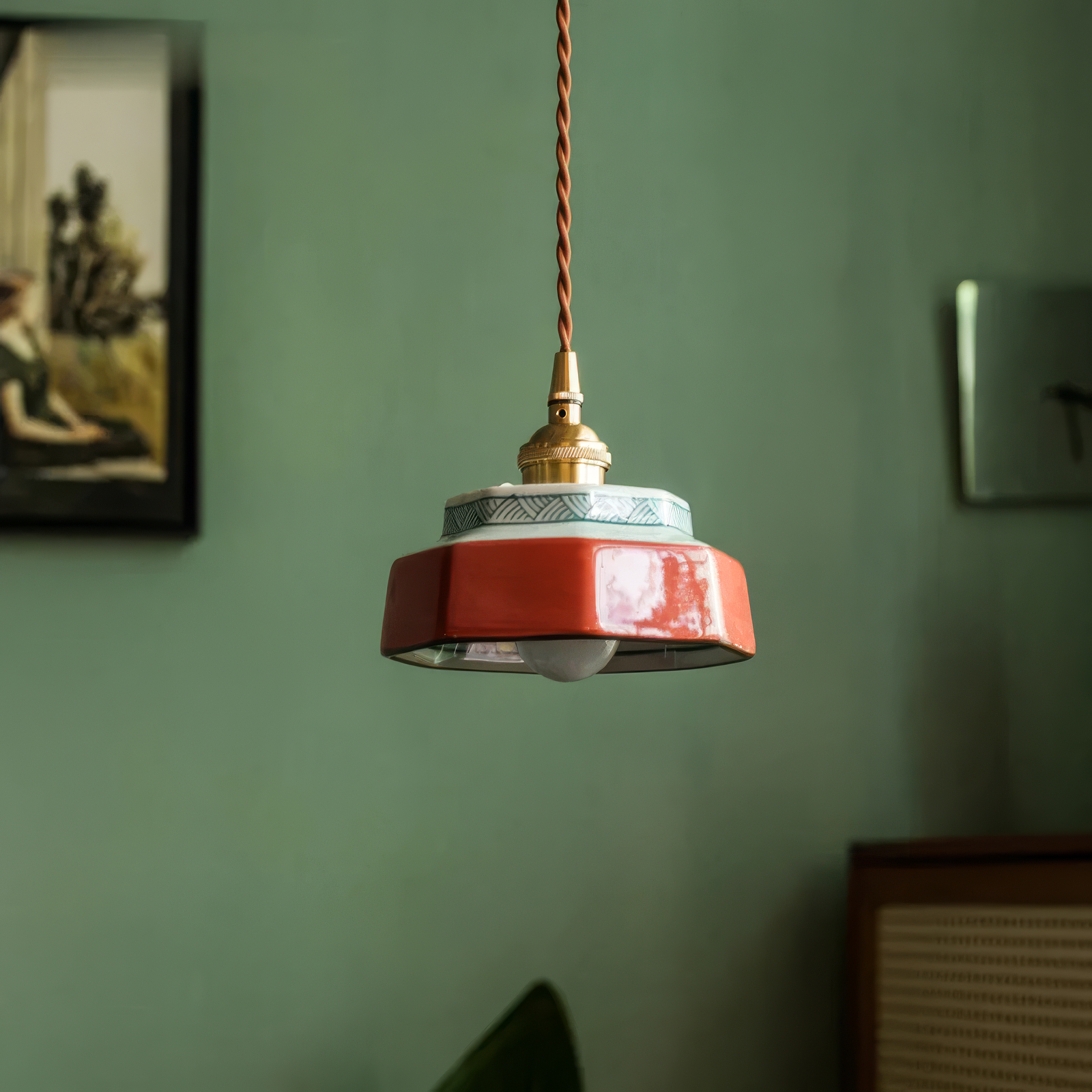 Sonja burnt clay hand-painted ceramic pendant light above a kitchen island