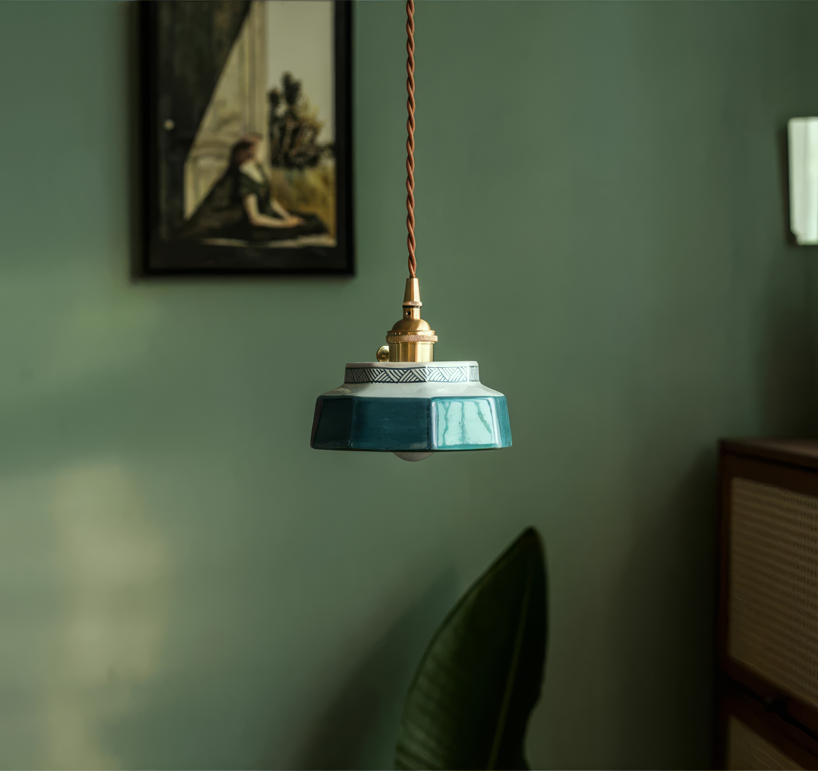 Sonja burnt clay hand-painted ceramic pendant light above a kitchen island
