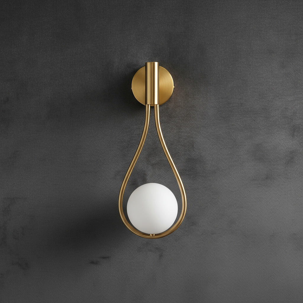 Livi gold Nordic wall sconce mounted beside a bed in a minimalist bedroom