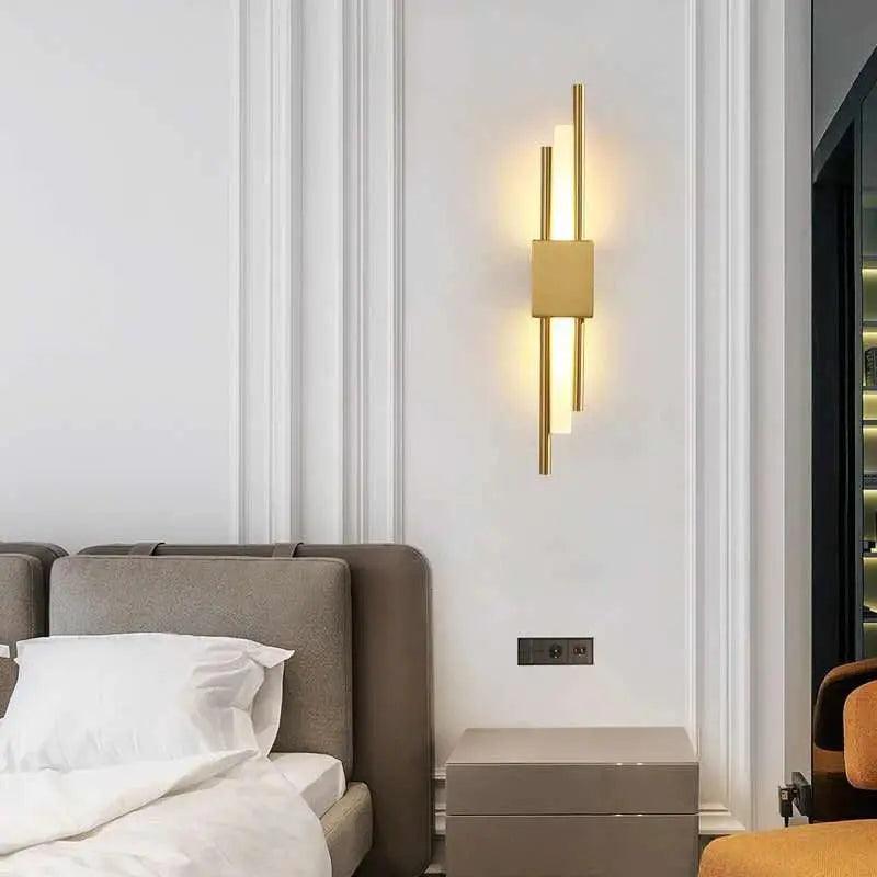Adan matte black articulated metal wall lamp mounted in a bedroom beside a headboard