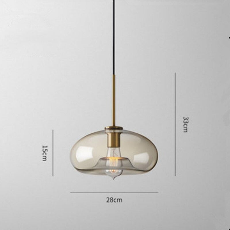 Millay cognac smoked glass pendant light in circle shape above a kitchen island