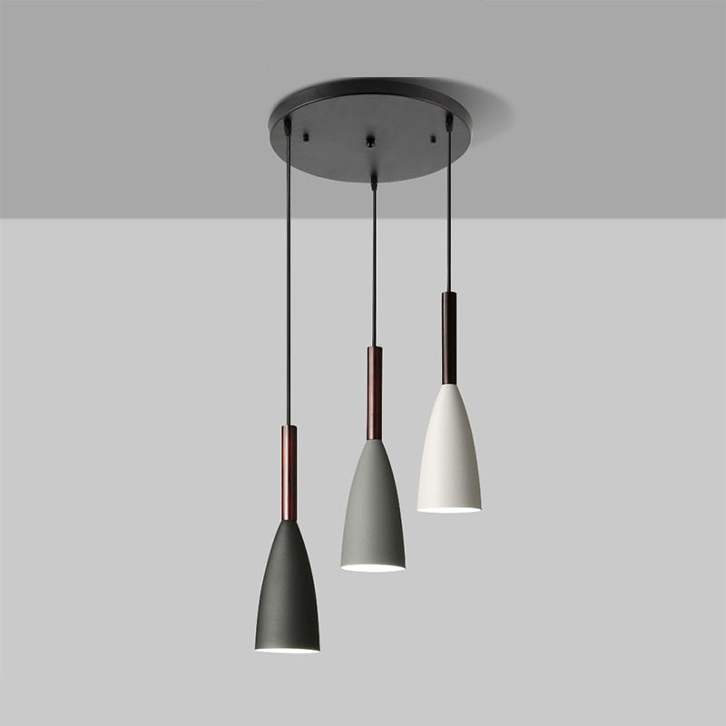 Trine triple aluminium pendant light in white above a kitchen island with adjustable cord lengths