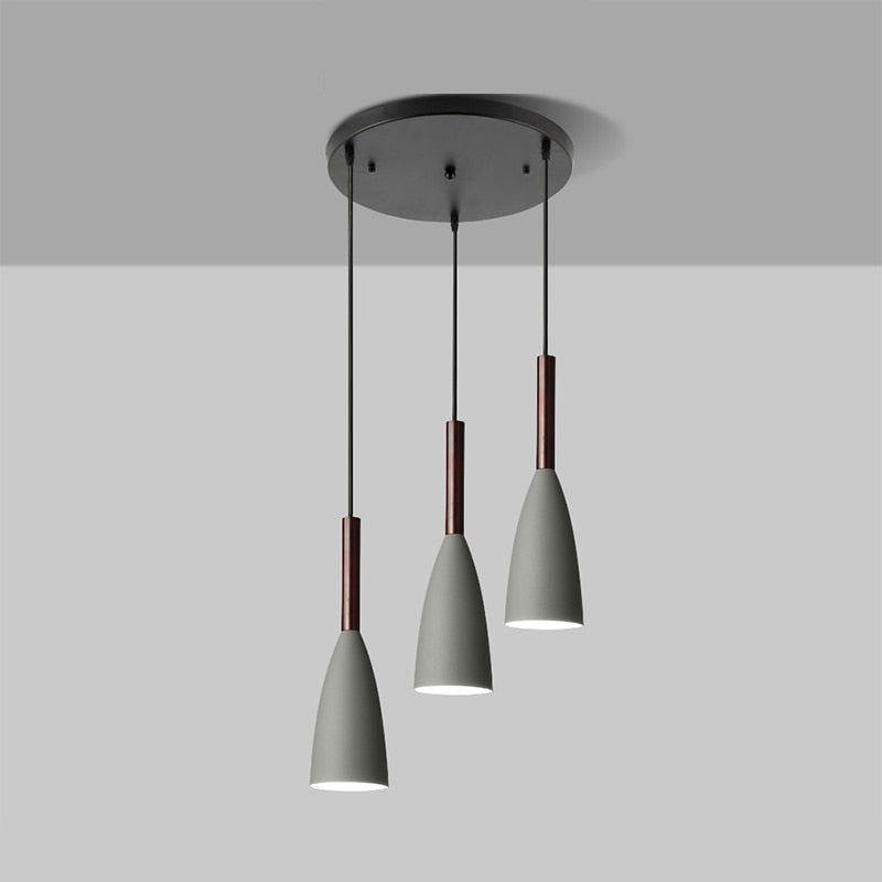 Trine triple aluminium pendant light in white above a kitchen island with adjustable cord lengths
