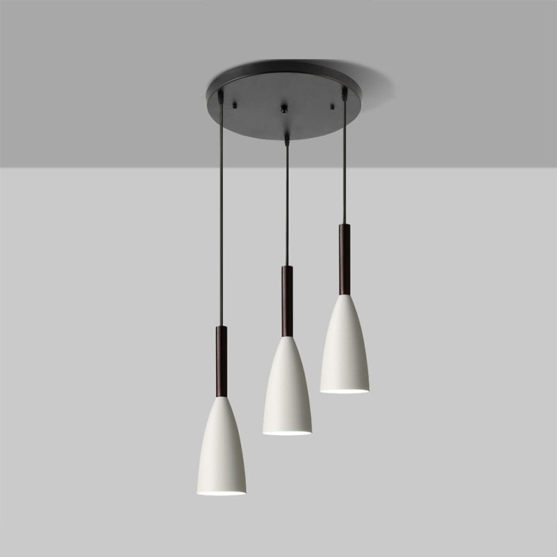 Trine triple aluminium pendant light in white above a kitchen island with adjustable cord lengths