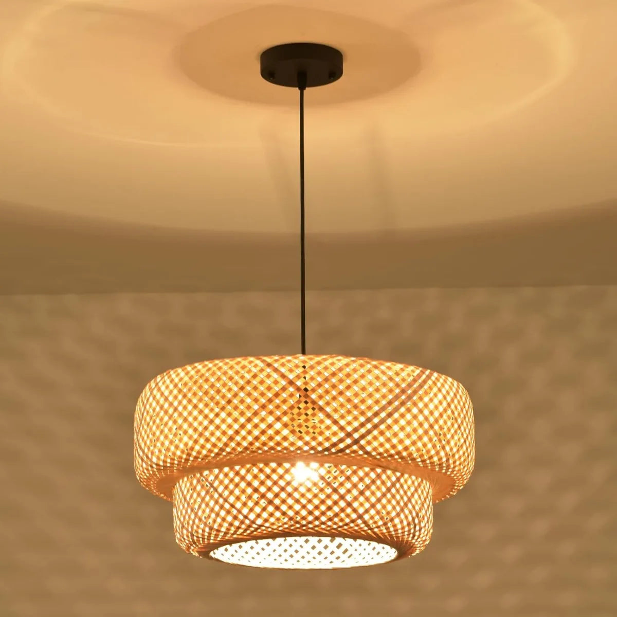 Halcyon double-weave bamboo pendant light hanging above a kitchen island in a modern British home