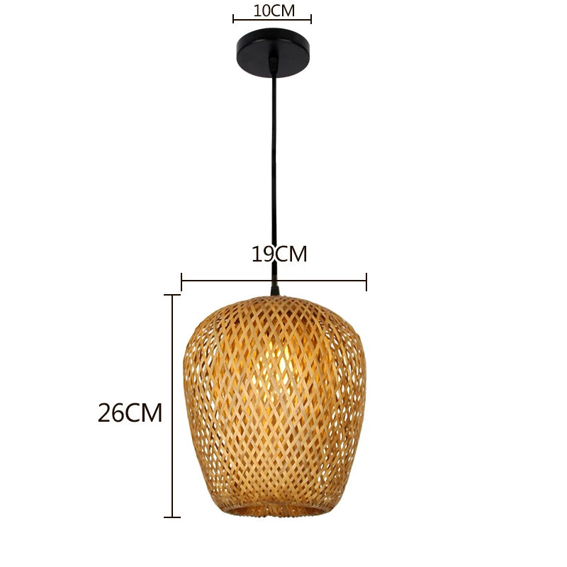 Wren handcrafted woven bamboo pendant light hanging above a wooden dining table in a warm interior