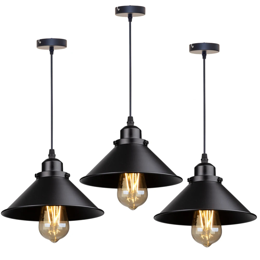 Camden vintage loft pendant light in black metal finish hanging above a kitchen dining table