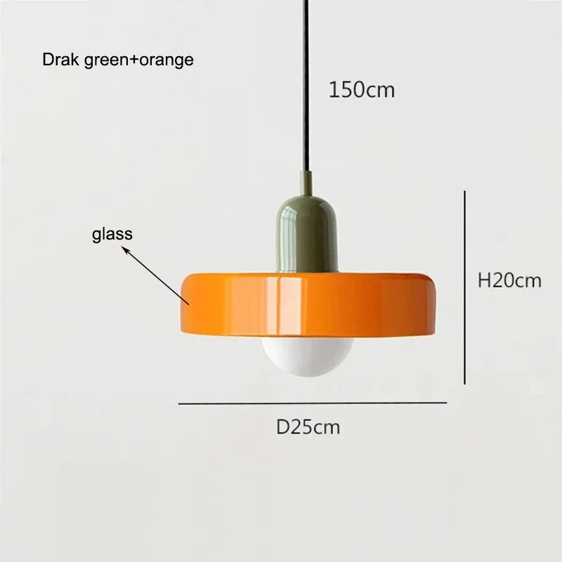Bauhaus multi-pendant glass chandelier with orange shades hanging above a dining table in a café