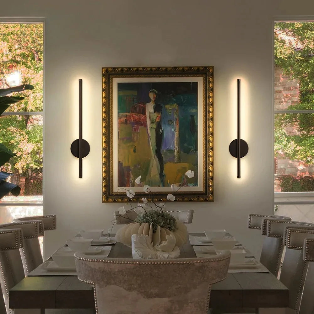 Volta magnetic rechargeable wall lamp in gold mounted in a hallway