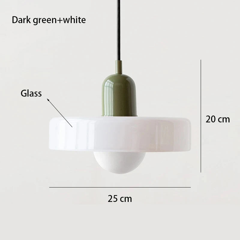 Bauhaus multi-pendant glass chandelier with orange shades hanging above a dining table in a café