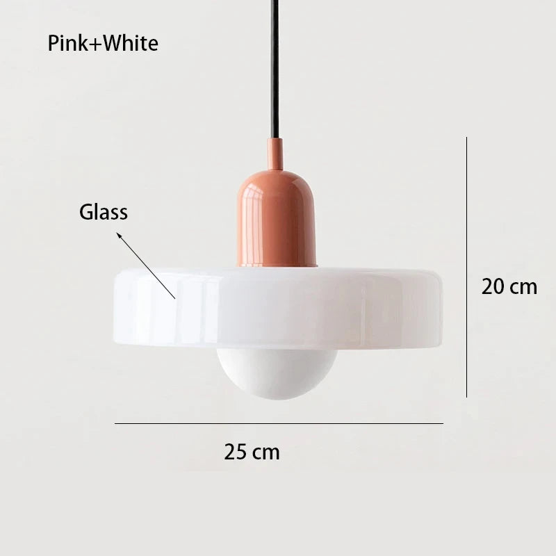Bauhaus multi-pendant glass chandelier with orange shades hanging above a dining table in a café