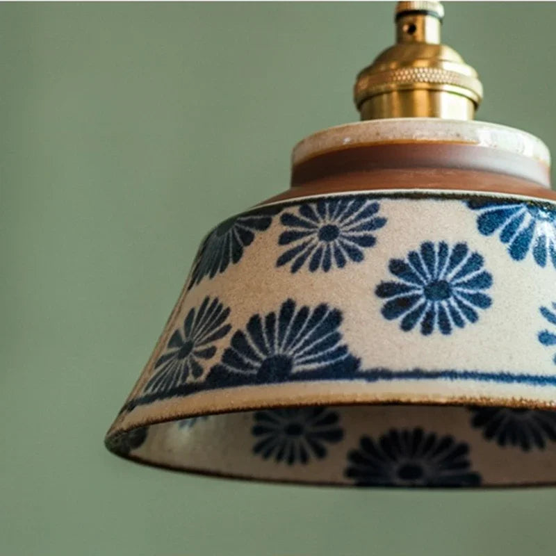 Ronja hand-painted blue floral ceramic pendant light hanging above a kitchen dining nook