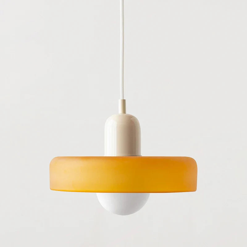 Kalle beige and white Bauhaus dual-tone glass pendant light hanging above a dining table