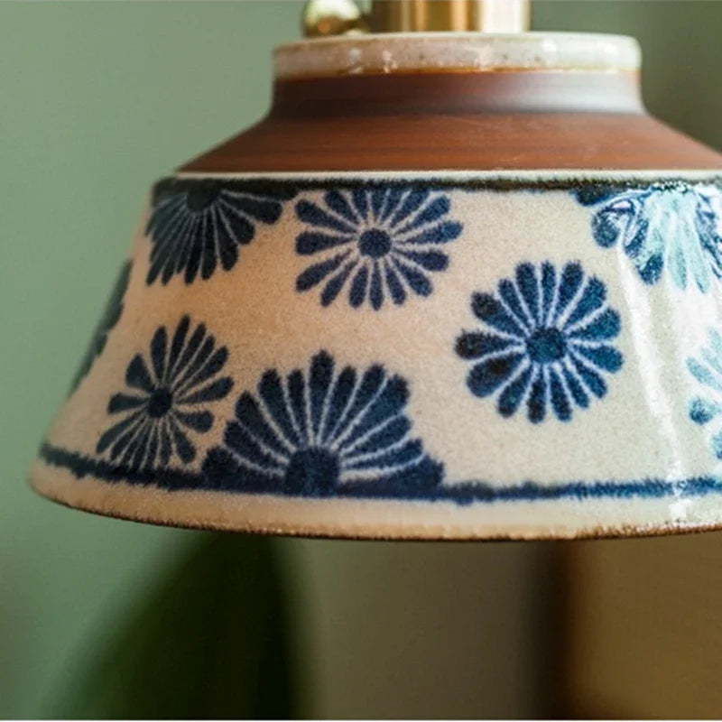 Ronja hand-painted blue floral ceramic pendant light hanging above a kitchen dining nook