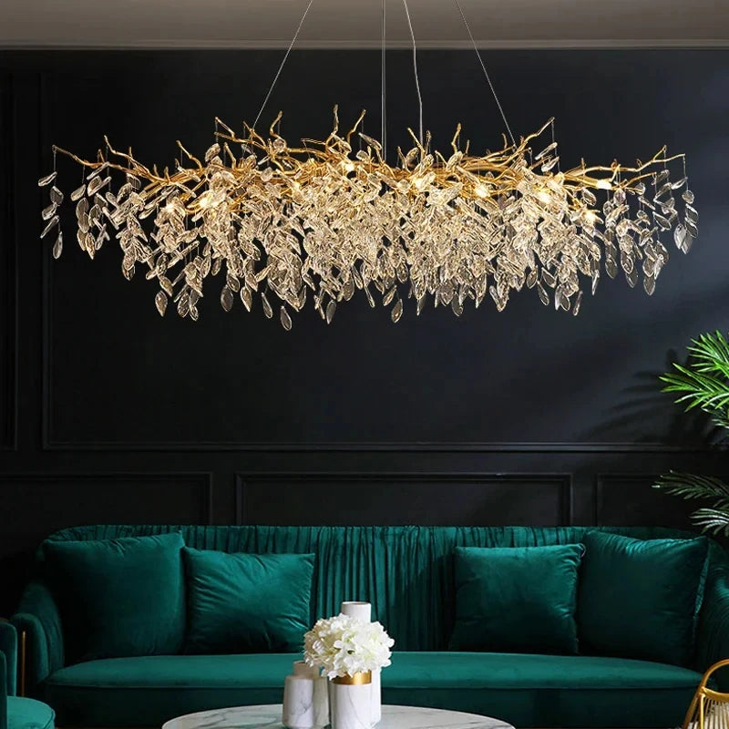 Aurelius brushed gold crystal LED chandelier hanging in a formal dining room