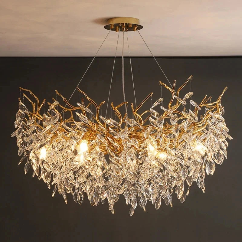 Aurelius brushed gold crystal LED chandelier hanging in a formal dining room