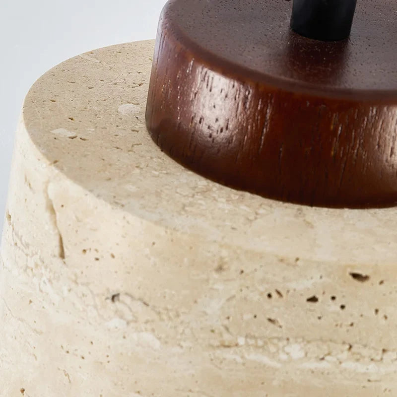 Vidar stone-effect sculptural pendant light in light finish above a dining table