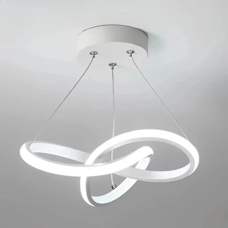 Strand slim Nordic LED ceiling pendant in white hanging in a dining room with low ceiling