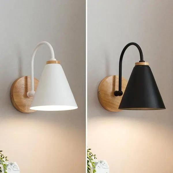 Saskia Nordic wall lamp in black with opal glass shade mounted in a contemporary bedroom