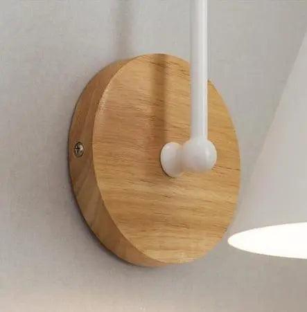 Saskia Nordic wall lamp in black with opal glass shade mounted in a contemporary bedroom