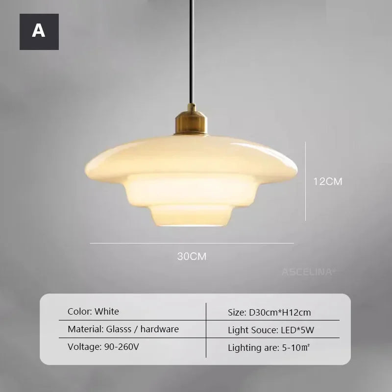 Opal milk glass pendant light hanging above a dining table, casting a soft warm glow