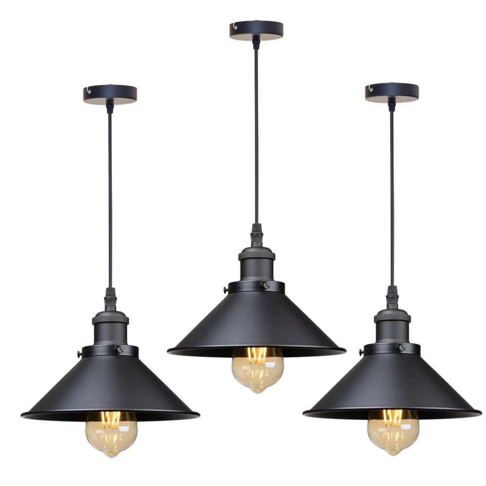 Camden vintage loft pendant light in black metal finish hanging above a kitchen dining table