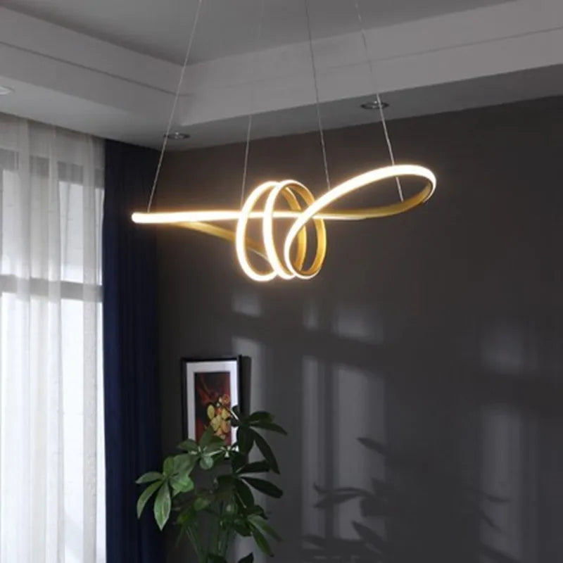 Islay dimmable LED kitchen pendant light in brushed gold above a marble kitchen island