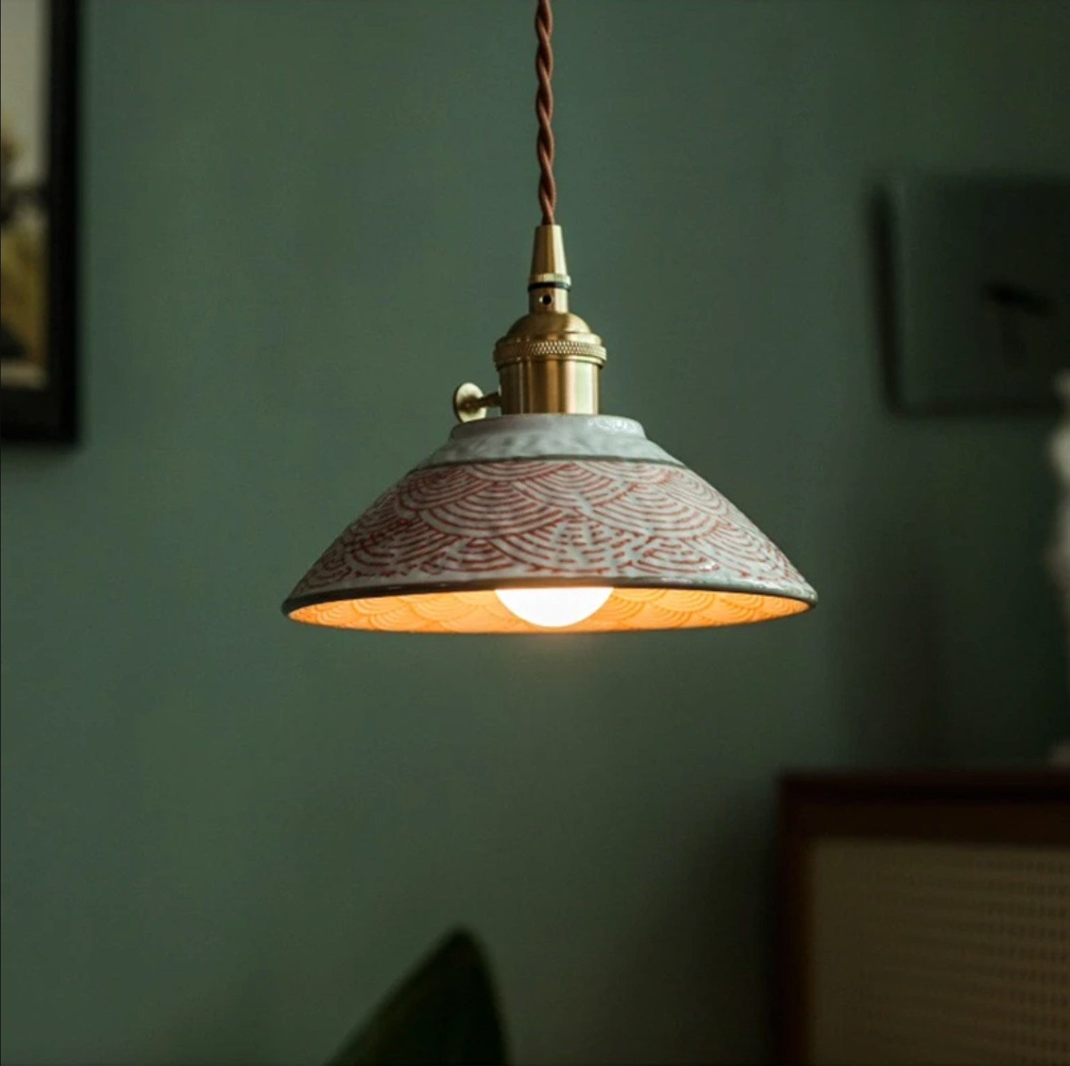 Ronja hand-painted blue floral ceramic pendant light hanging above a kitchen dining nook