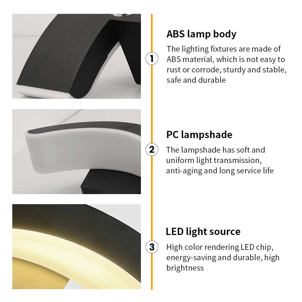 Hadley IP66 weatherproof outdoor wall lantern in black, mounted on a rendered exterior wall