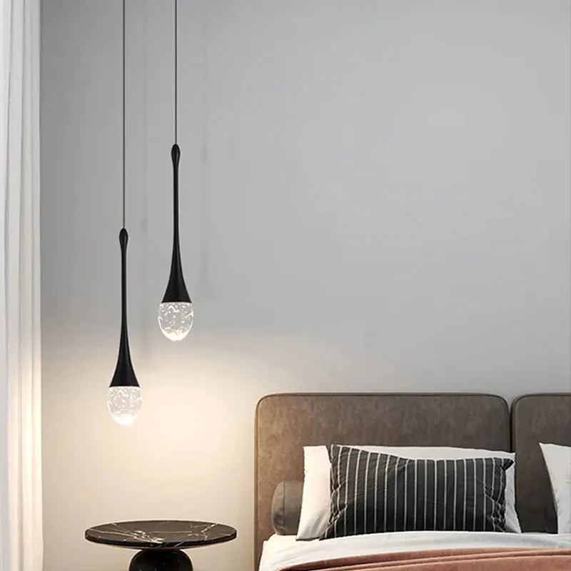 Dewdrop crystal cluster pendant light with multiple glass spheres hanging above a dining table