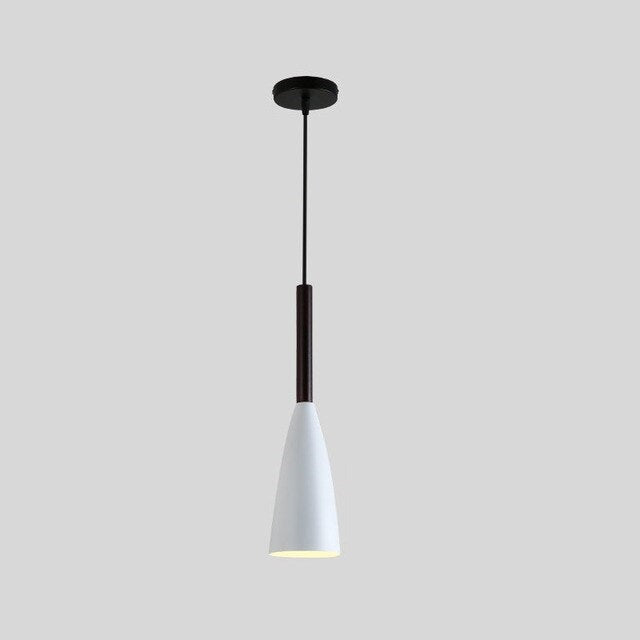 Trine triple aluminium pendant light in white above a kitchen island with adjustable cord lengths