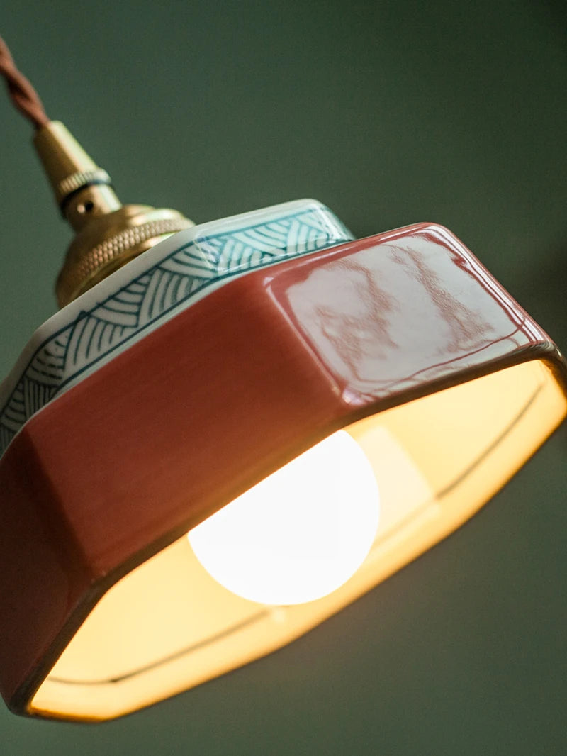 Sonja burnt clay hand-painted ceramic pendant light above a kitchen island