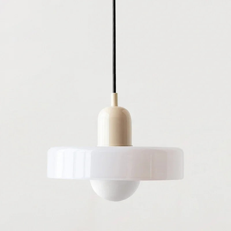 Kalle beige and white Bauhaus dual-tone glass pendant light hanging above a dining table