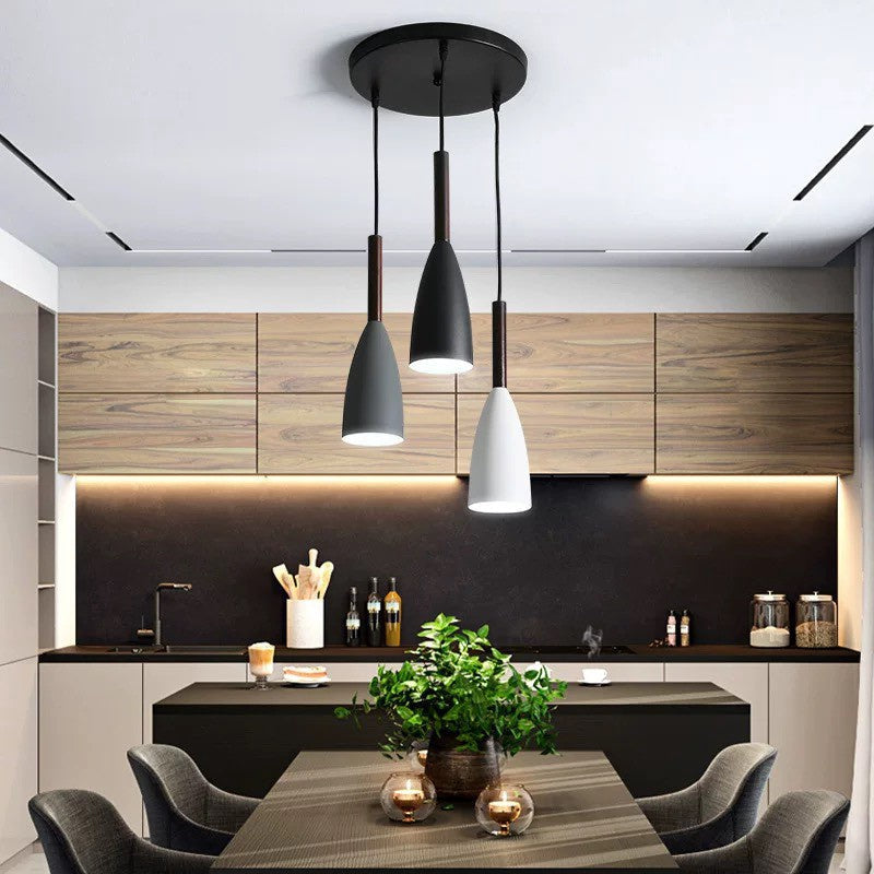 Trine triple aluminium pendant light in white above a kitchen island with adjustable cord lengths