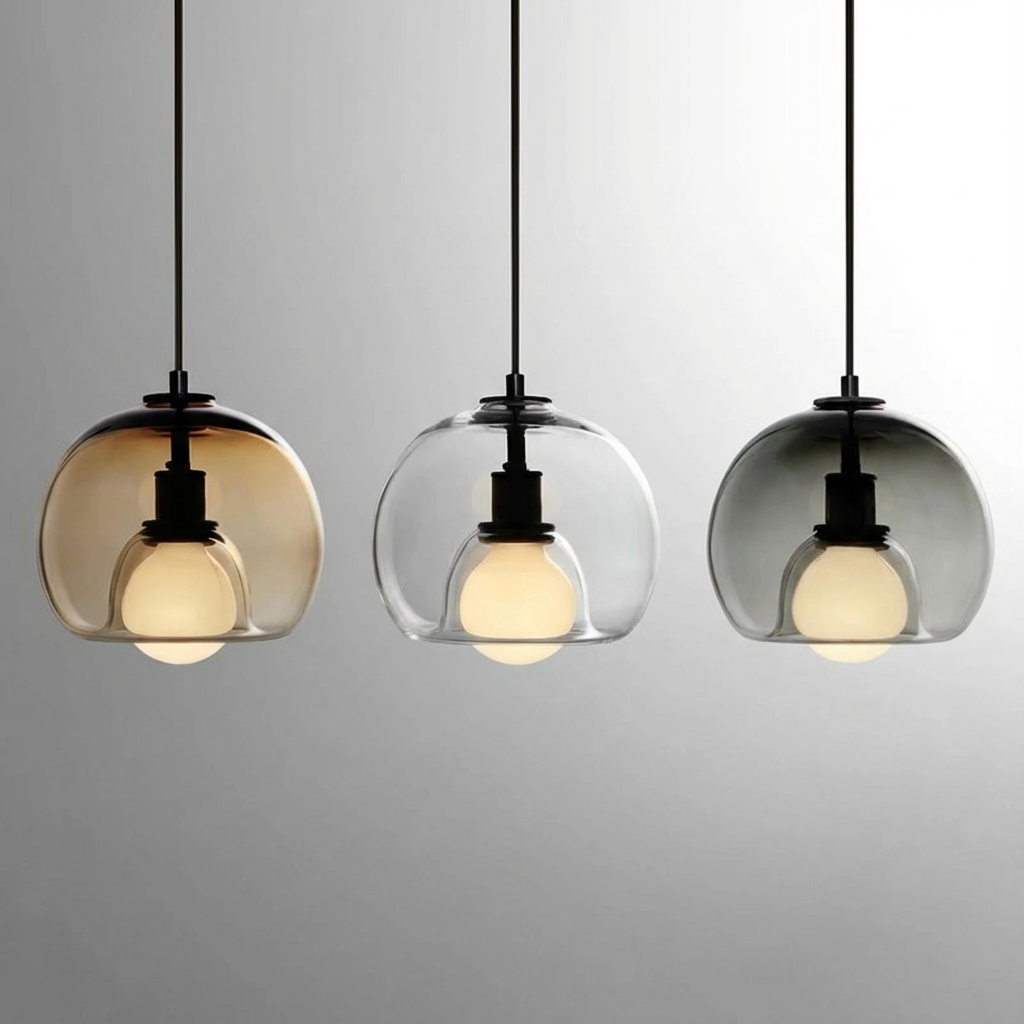 Anele smoke grey dome glass pendant light in a row of three above a kitchen island