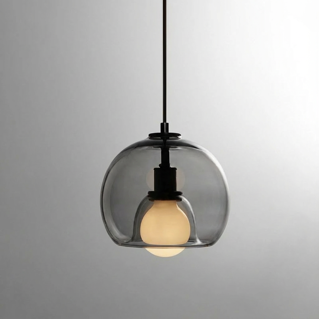 Anele smoke grey dome glass pendant light in a row of three above a kitchen island
