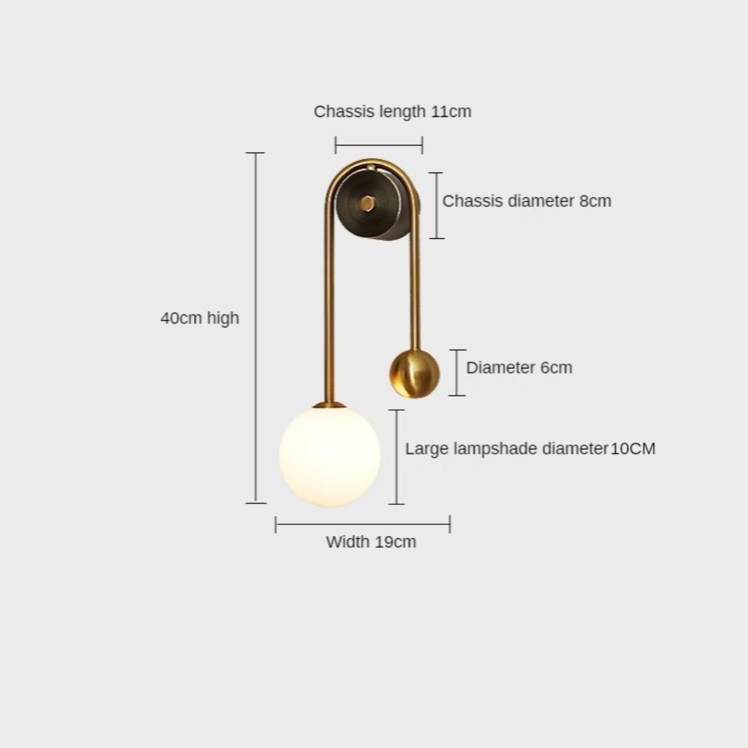 Amalia twin-arm gold Nordic wall sconce with white glass shades flanking a dining room mirror