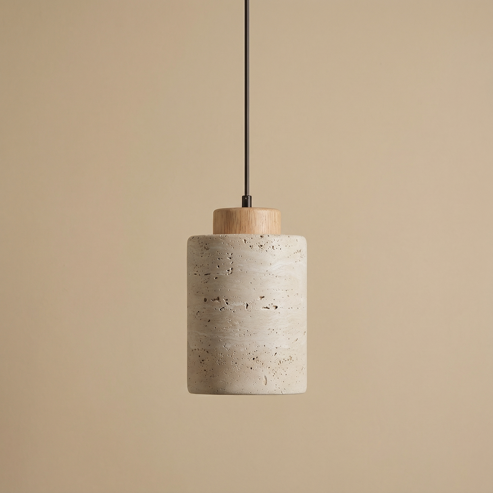 Vidar stone-effect sculptural pendant light in light finish above a dining table