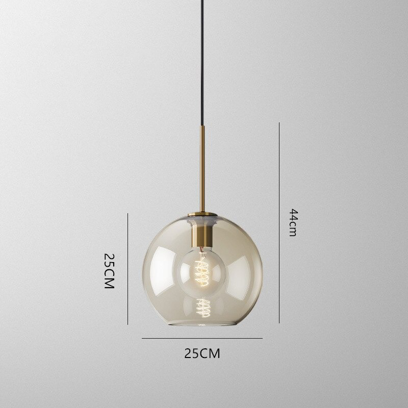 Millay cognac smoked glass pendant light in circle shape above a kitchen island