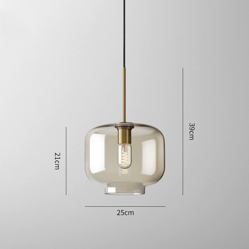 Millay cognac smoked glass pendant light in circle shape above a kitchen island