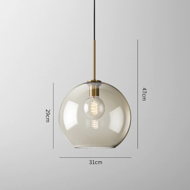Millay cognac smoked glass pendant light in circle shape above a kitchen island
