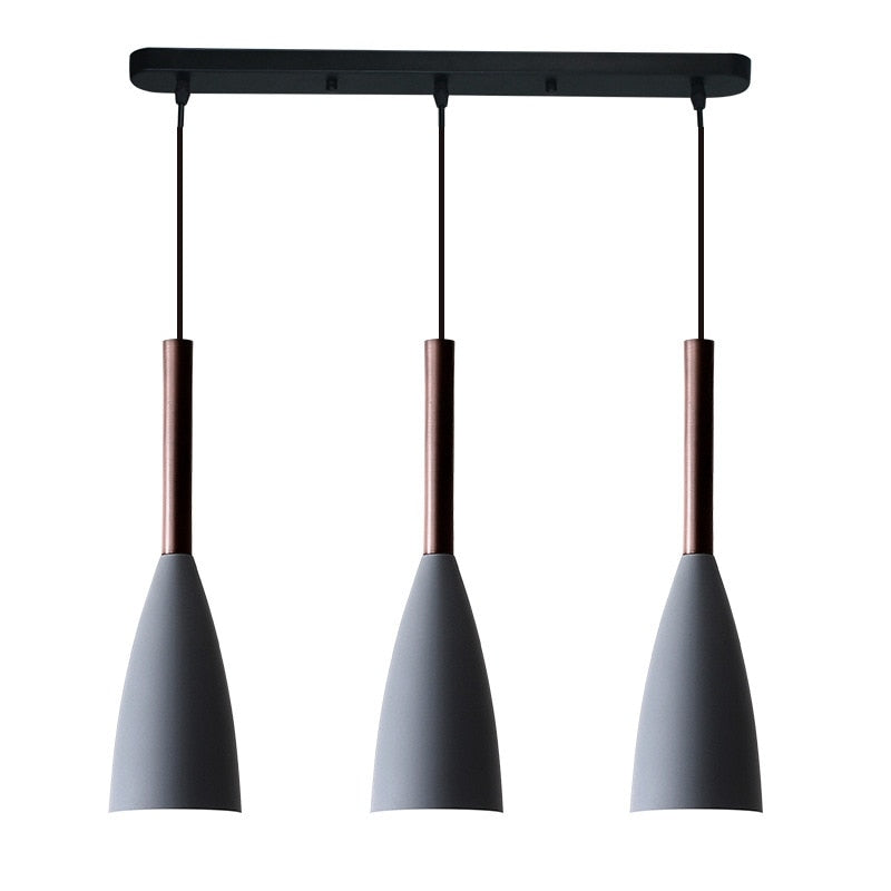 Trine triple aluminium pendant light in white above a kitchen island with adjustable cord lengths