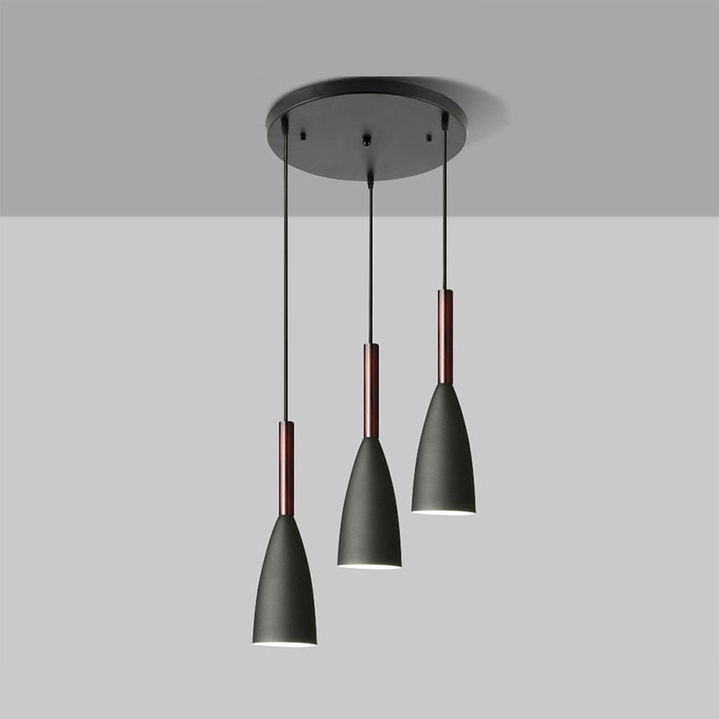 Trine triple aluminium pendant light in white above a kitchen island with adjustable cord lengths