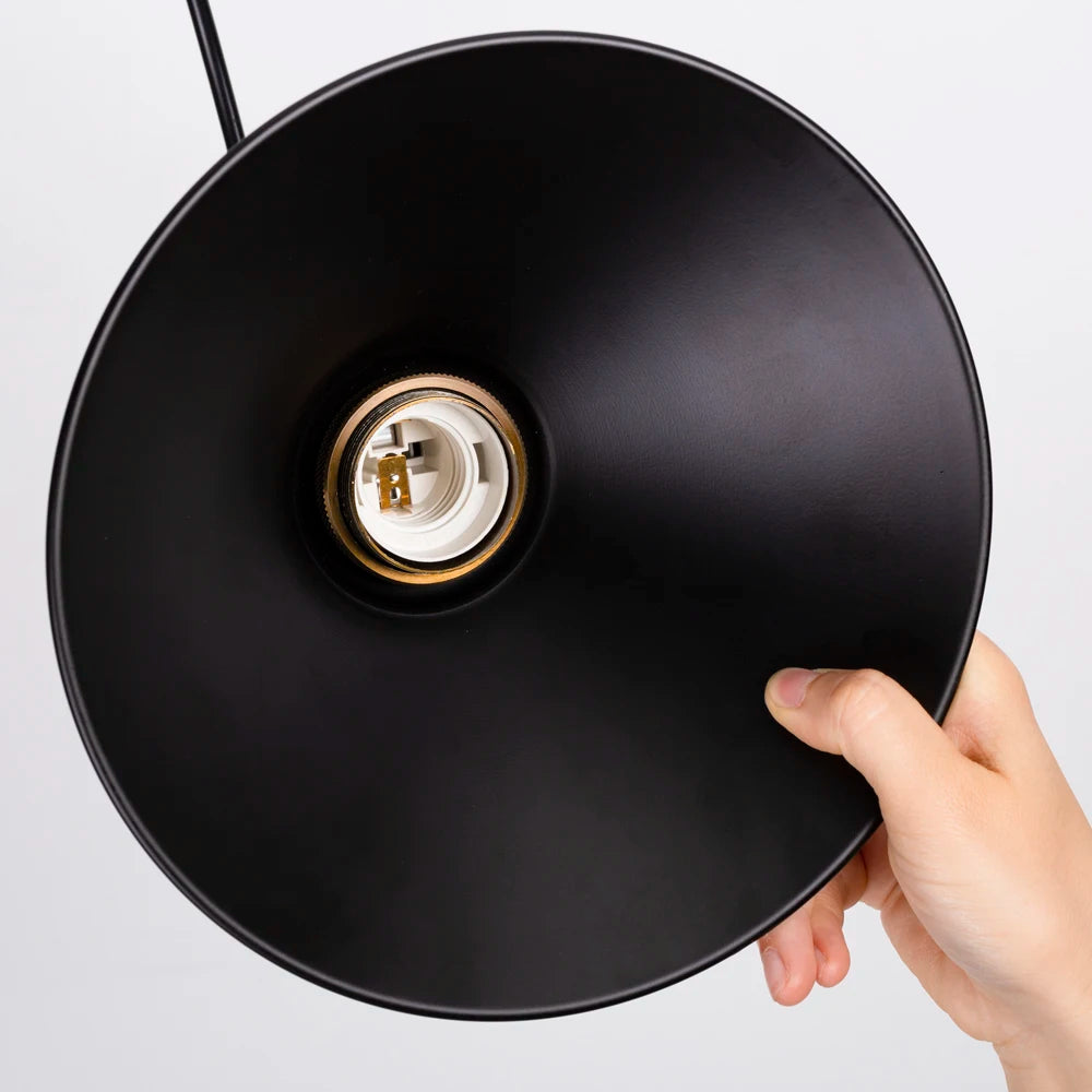 Camden vintage loft pendant light in black metal finish hanging above a kitchen dining table