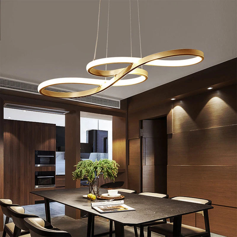 Islay dimmable LED kitchen pendant light in brushed gold above a marble kitchen island