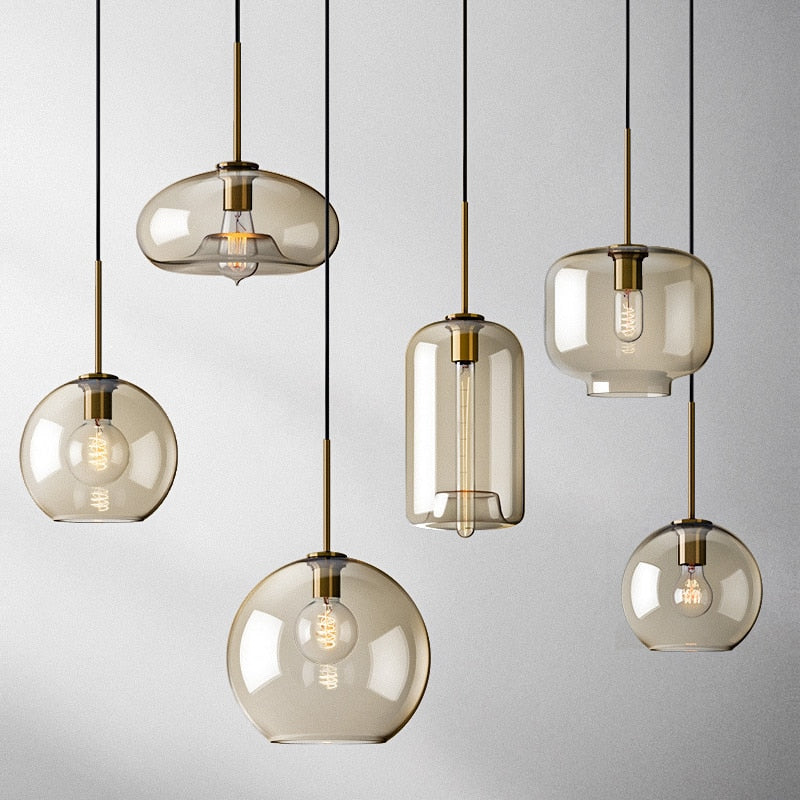 Millay cognac smoked glass pendant light in circle shape above a kitchen island