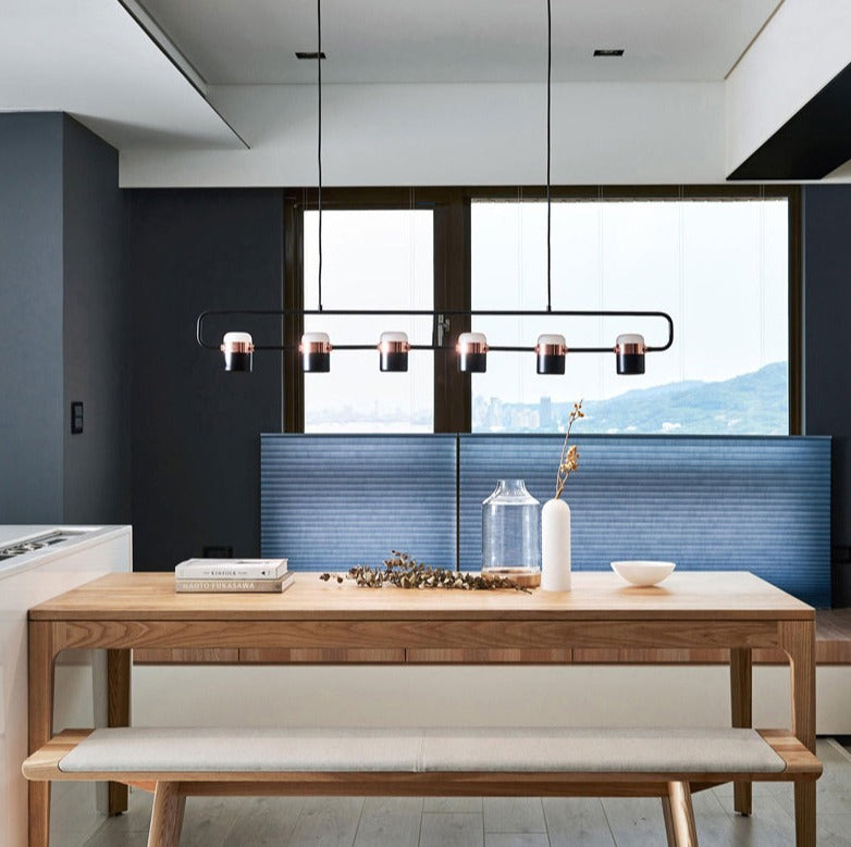 La Scène 3-head Nordic LED chandelier in white hanging above a kitchen island