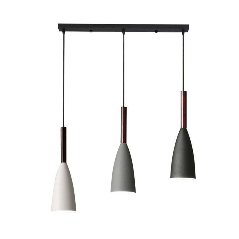 Trine triple aluminium pendant light in white above a kitchen island with adjustable cord lengths