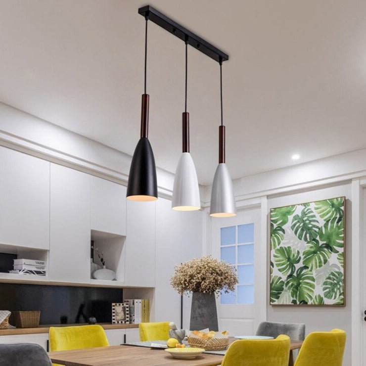 Trine triple aluminium pendant light in white above a kitchen island with adjustable cord lengths